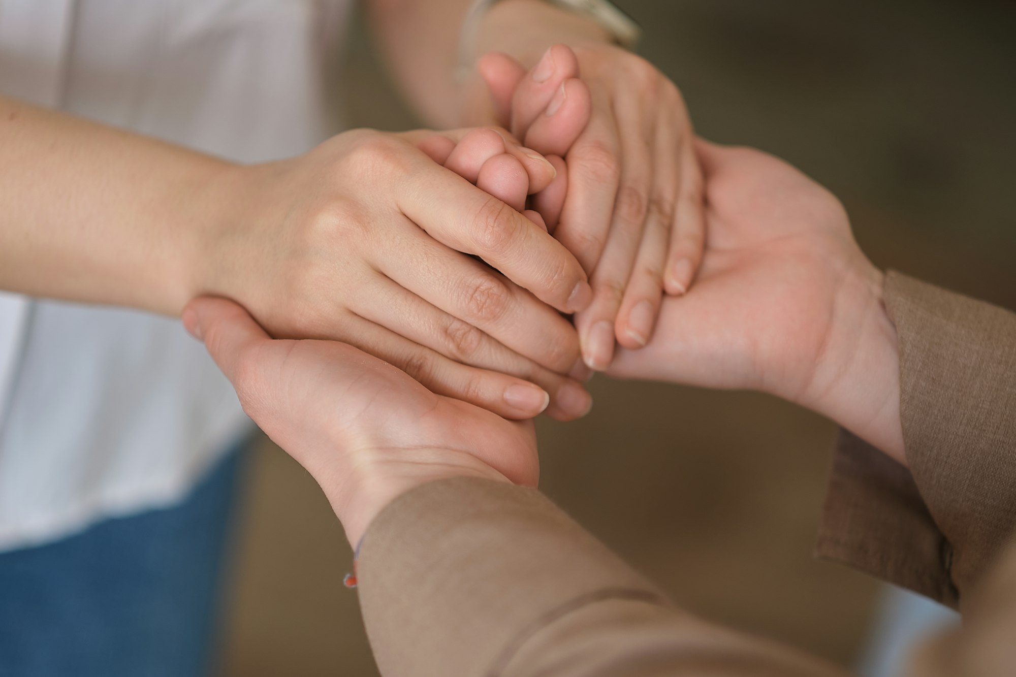 woman holding another in a comforting embrace, mental health awareness and the importance of